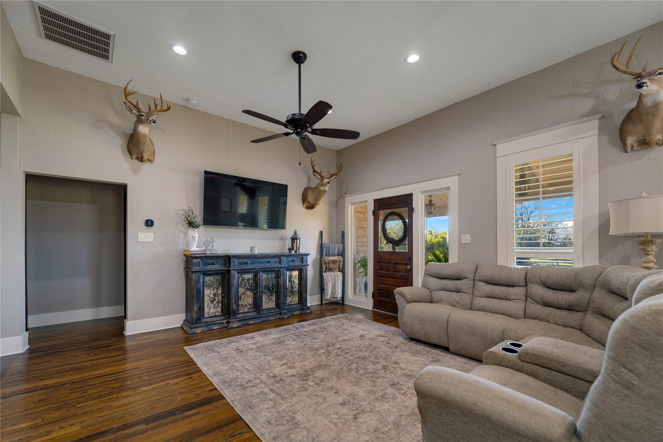 8323 East State Highway 29 Georgetown, TX 78626 - Photo 14 of 39 a living room with furniture and a flat screen tv