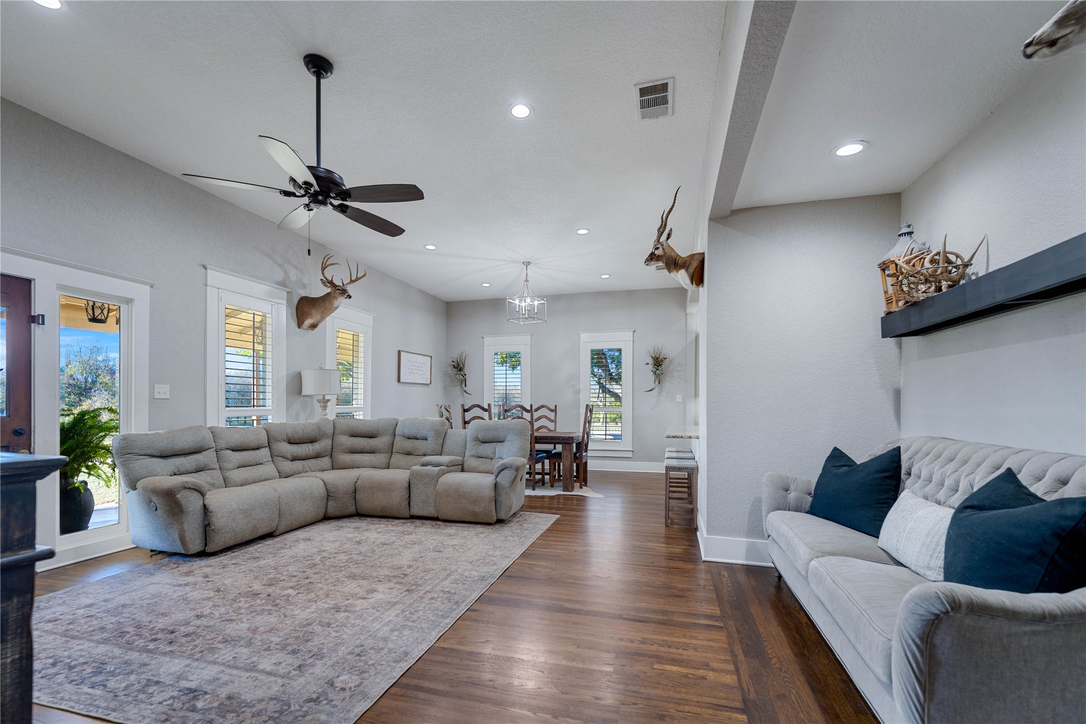 8323 East State Highway 29 Georgetown, TX 78626 - Photo 16 of 39 a living room with furniture kitchen view and a wooden floor