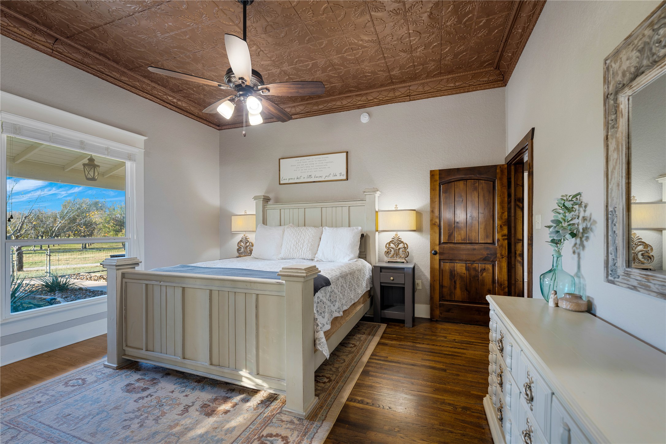 8323 East State Highway 29 Georgetown, TX 78626 - Photo 17 of 39 a view of a bedroom with wooden floor and windows