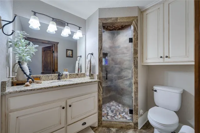 a bedroom with a bed and a table in it