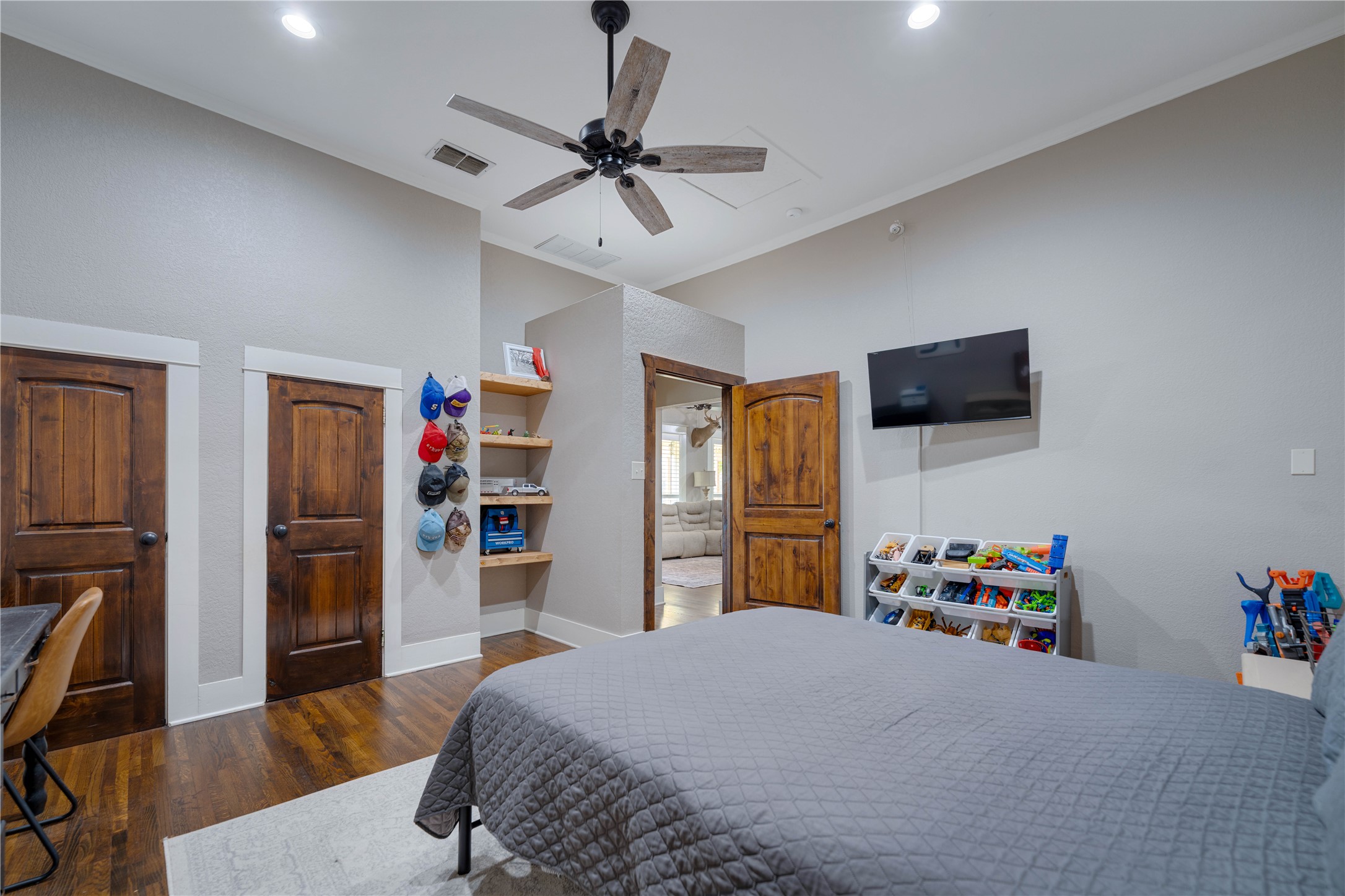 8323 East State Highway 29 Georgetown, TX 78626 - Photo 26 of 39 a bedroom with a bed dresser and a flat screen tv