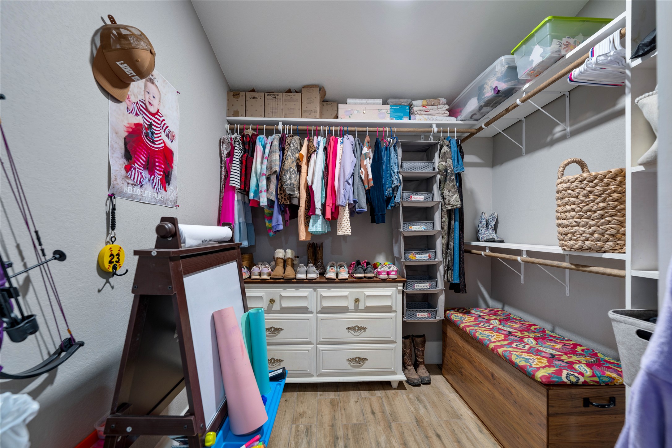 8323 East State Highway 29 Georgetown, TX 78626 - Photo 29 of 39 a view of walk in closet with clothes and shoes