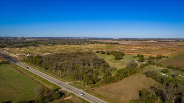 a view of outdoor space with swimming pool and trees in the background