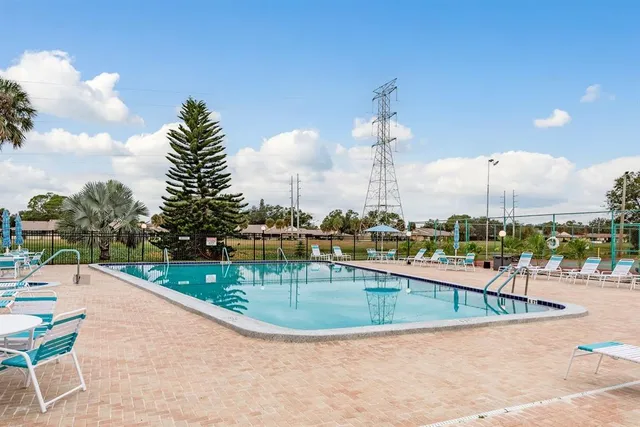 swimming pool view with a garden space