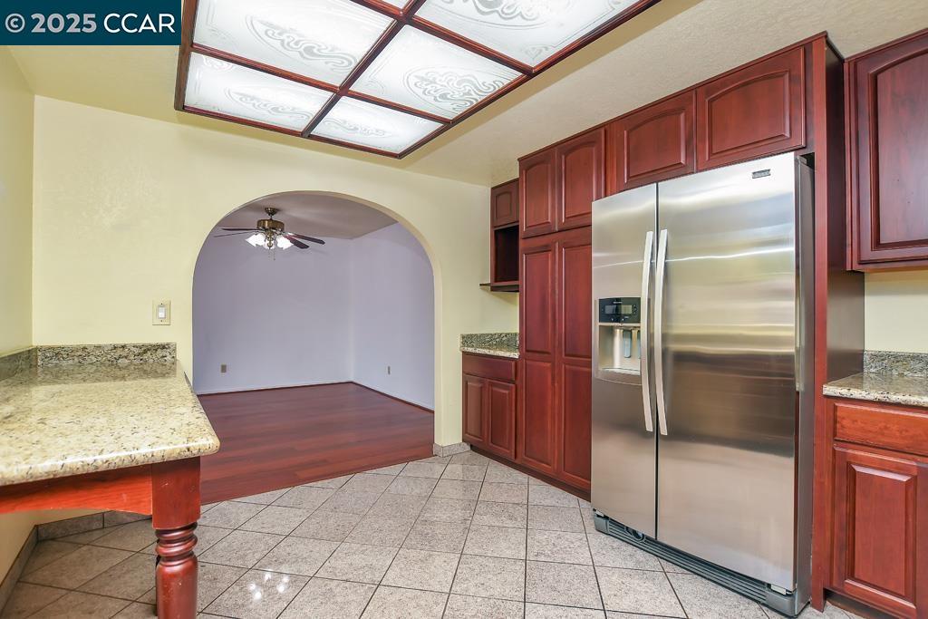 65 Edgewater Place Pittsburg, CA 94565 - Photo 14 of 31 a kitchen with stainless steel appliances granite countertop a refrigerator and a sink
