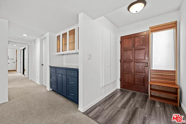 a view of kitchen and wooden floor