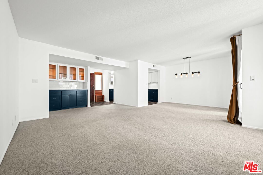 1312 South Saltair Avenue, Unit 215 Los Angeles, CA 90025 - Photo 7 of 31 a view of a kitchen with a sink and cabinets