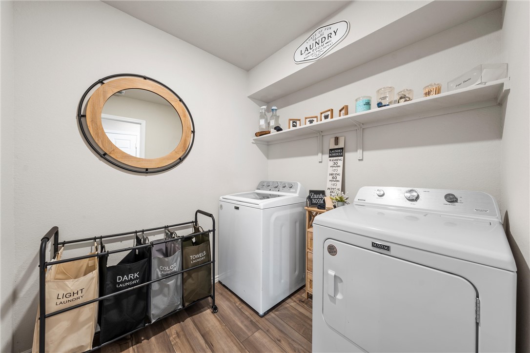 7009 Llano Drive China Spring, TX 76633 - Photo 11 of 25 a utility room with dryer and washer