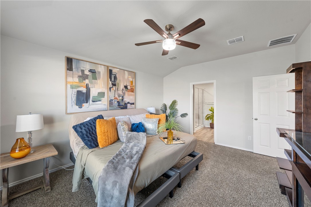 7009 Llano Drive China Spring, TX 76633 - Photo 7 of 25 a bed room with a bed and a painting on the wall