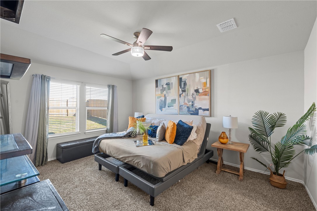 7009 Llano Drive China Spring, TX 76633 - Photo 8 of 25 a bedroom with a bed and glass window