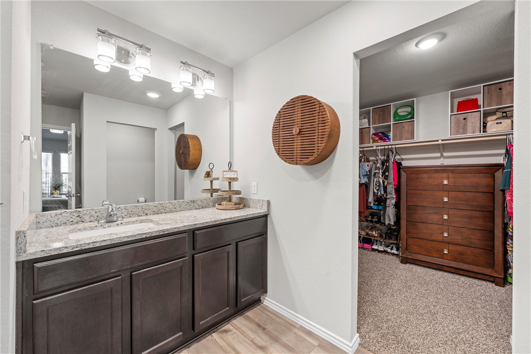 7009 Llano Drive China Spring, TX 76633 - Photo 9 of 25 a bathroom with a sink a vanity and a mirror