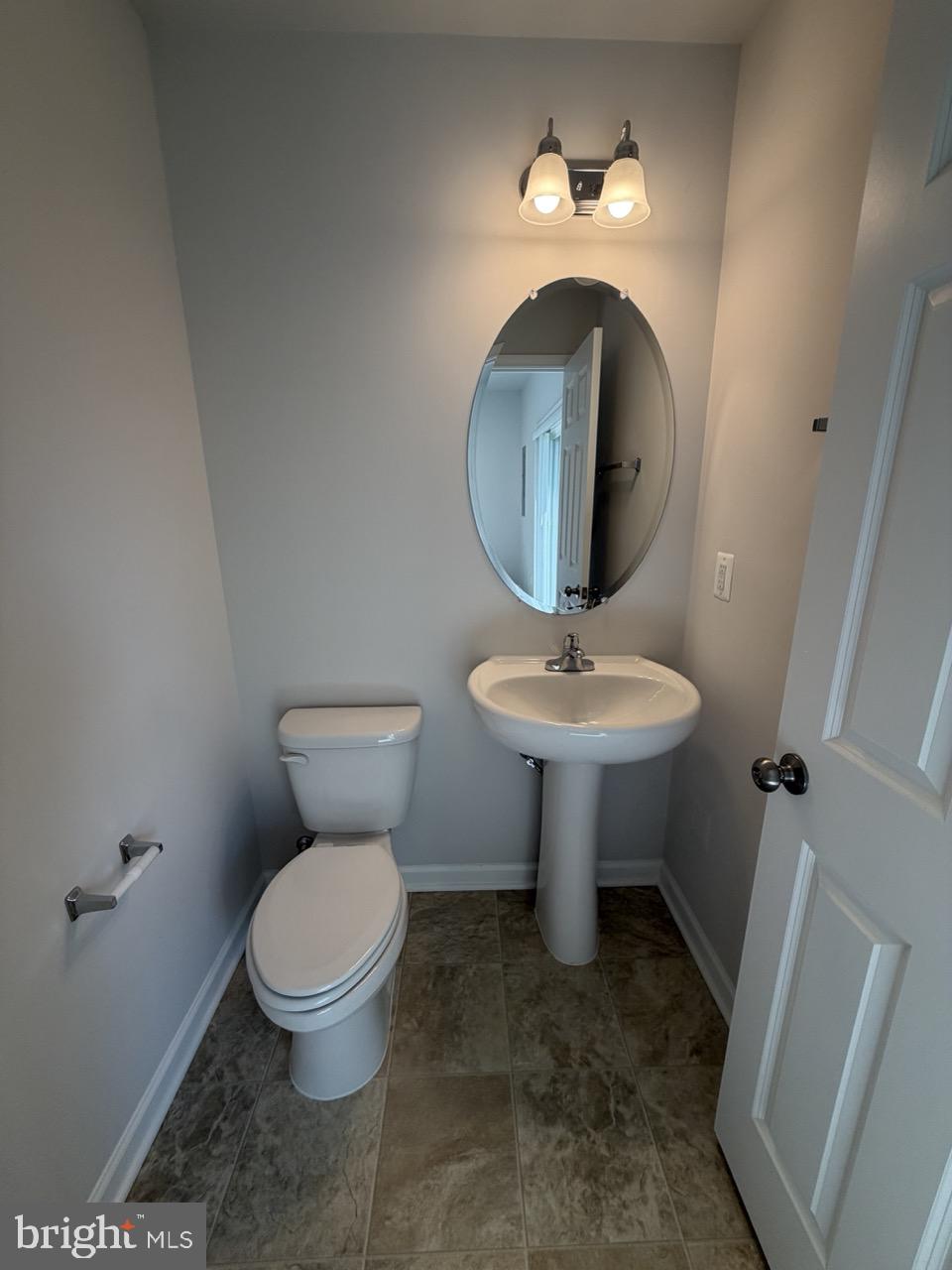 146 Galaxy Place Stephenson, VA 22656 - Photo 9 of 46 a bathroom with a toilet sink and mirror