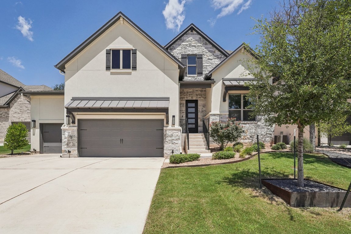 a front view of a house with a yard
