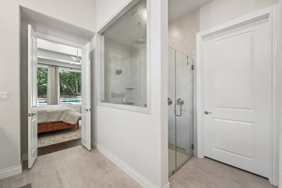 120 Hollytree Court Georgetown, TX 78628 - Photo 21 of 40 a bedroom with a bed and a window