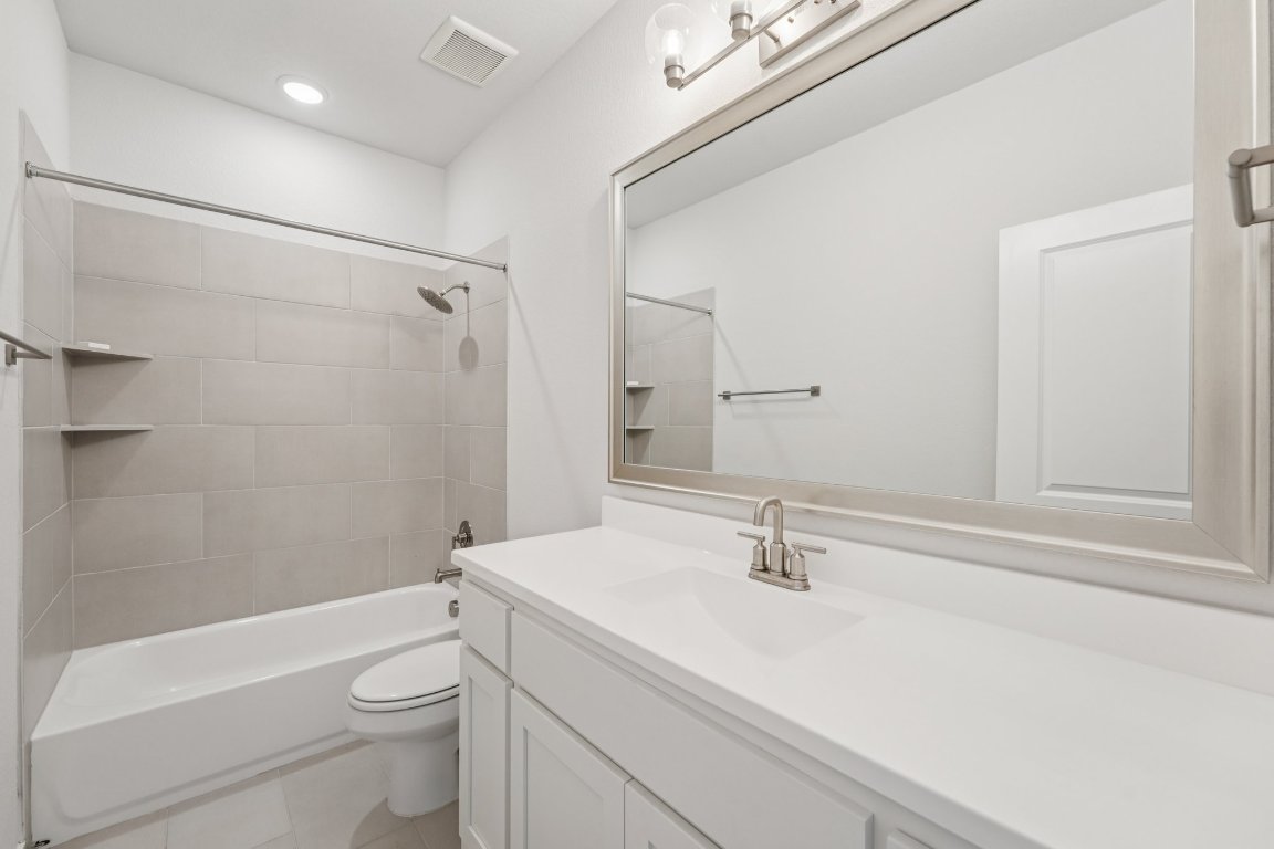 120 Hollytree Court Georgetown, TX 78628 - Photo 26 of 40 a bathroom with a sink a toilet and shower