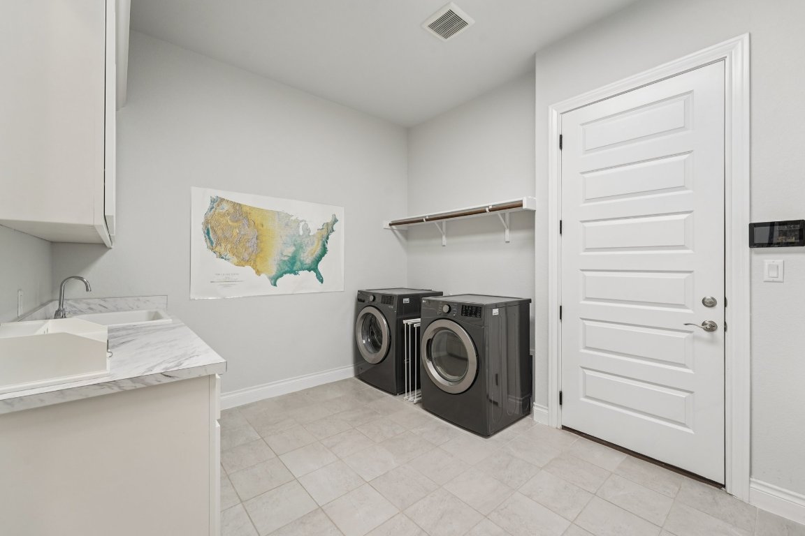 120 Hollytree Court Georgetown, TX 78628 - Photo 29 of 40 a utility room with sink dryer and washer