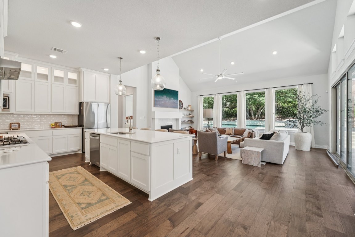 120 Hollytree Court Georgetown, TX 78628 - Photo 6 of 40 a large white kitchen with a large window and white stainless steel appliances
