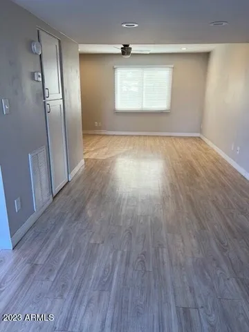a kitchen with granite countertop a sink and a stove top oven
