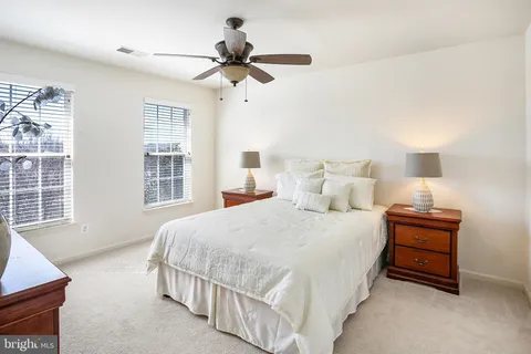 a bedroom with bed and window