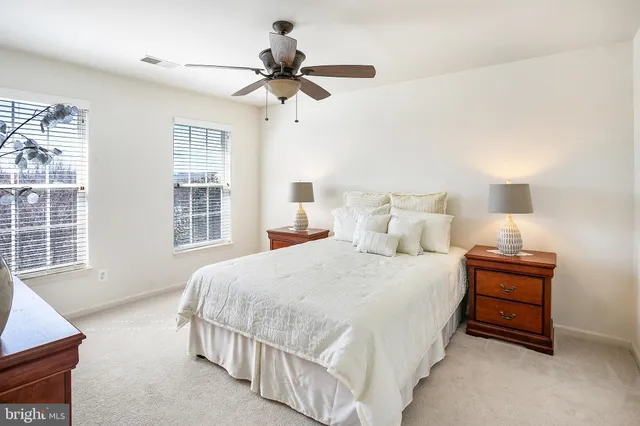 a bedroom with bed and window