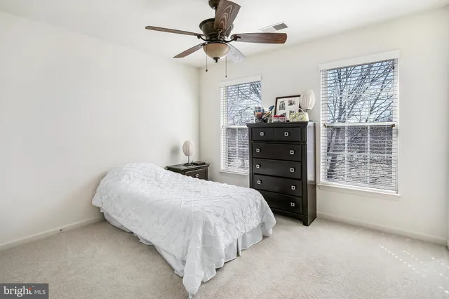 a bedroom with a bed and a closet