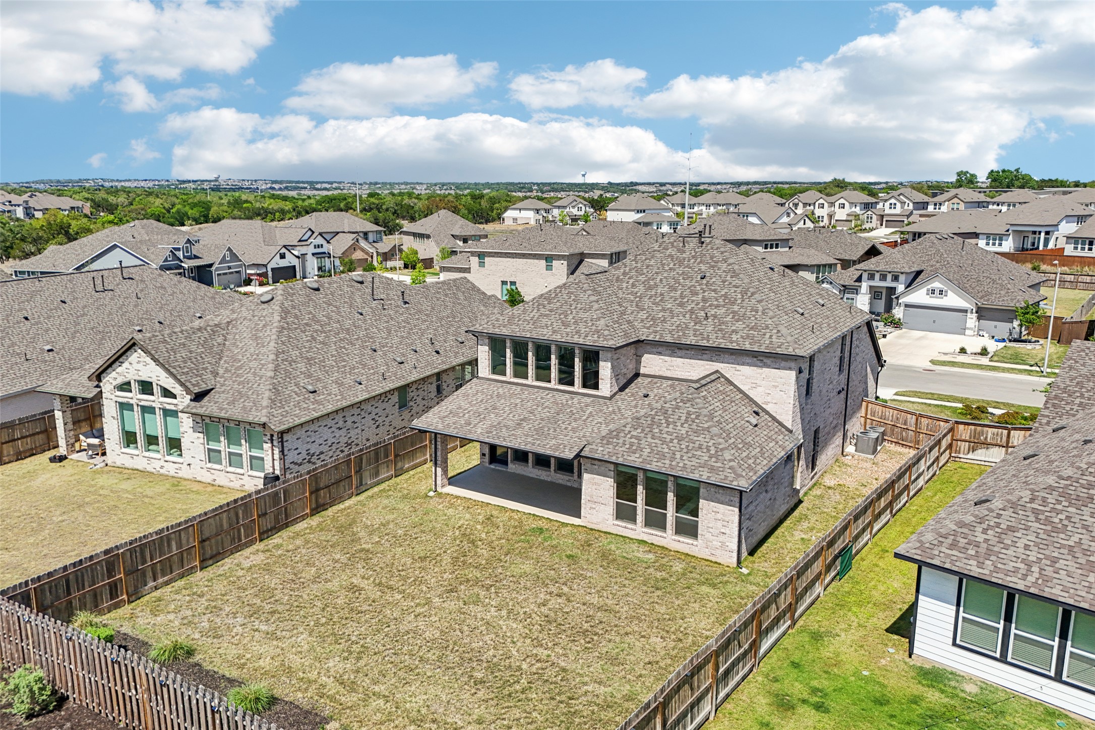 1140 Bryson Rdg Trail Leander, TX 78641 - Photo 31 of 39 The property features a spacious yard with a wooden fence