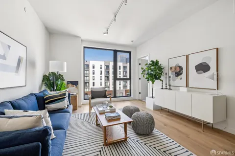 a living room with furniture and a rug
