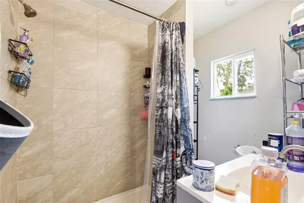 a bathroom with a toilet and shower