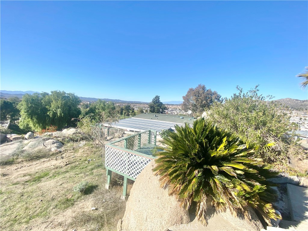 30865 Allen Avenue Homeland, CA 92548 - Photo 14 of 18 a view of a lake with a palm tree