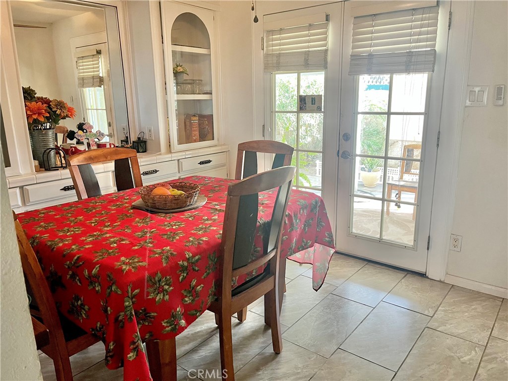 30865 Allen Avenue Homeland, CA 92548 - Photo 2 of 18 a bedroom with a bed and large windows