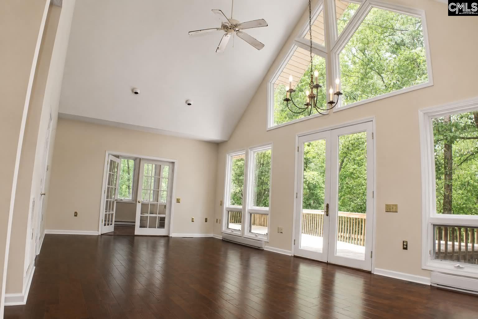 111 Lakeview Road Eastover, SC 29044 - Photo 7 of 39 a view of an empty room with wooden floor and a window