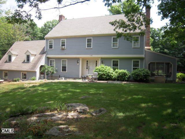 5 Abbotts Hill Road Newtown, CT 06470 - Photo 1 of 1 a front view of a house with a garden