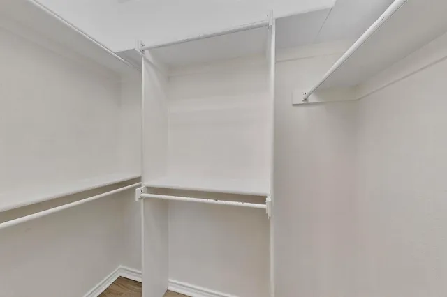 a view of an empty walk in closet