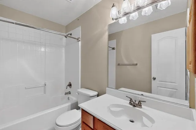 a bathroom with a sink toilet tub and shower