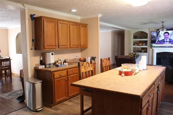 a kitchen with a stove a sink and a refrigerator