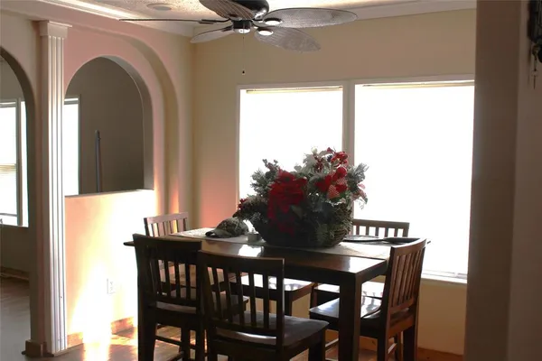 a dining room with furniture and window