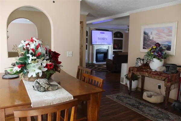 a living room with furniture and flowers