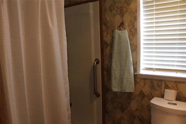 a bathroom with a shower curtain
