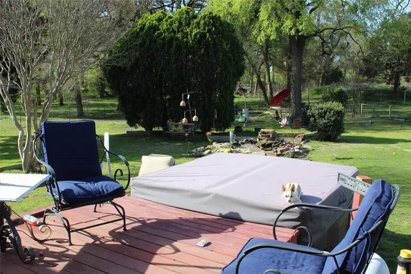 a patio with table and chairs