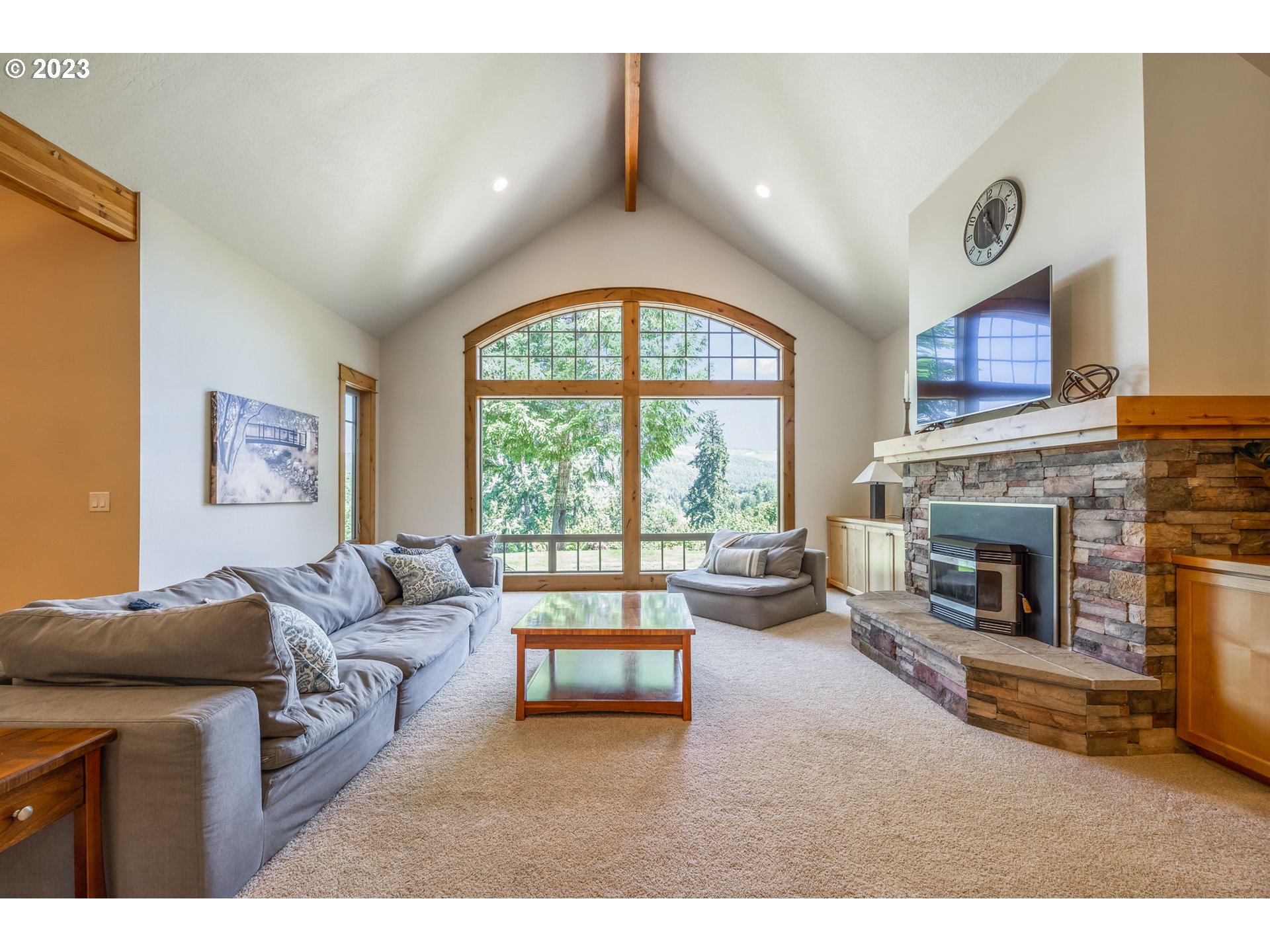 40091 Deerhorn Road Springfield, OR 97478 - Photo 11 of 46 a living room with furniture and a fireplace