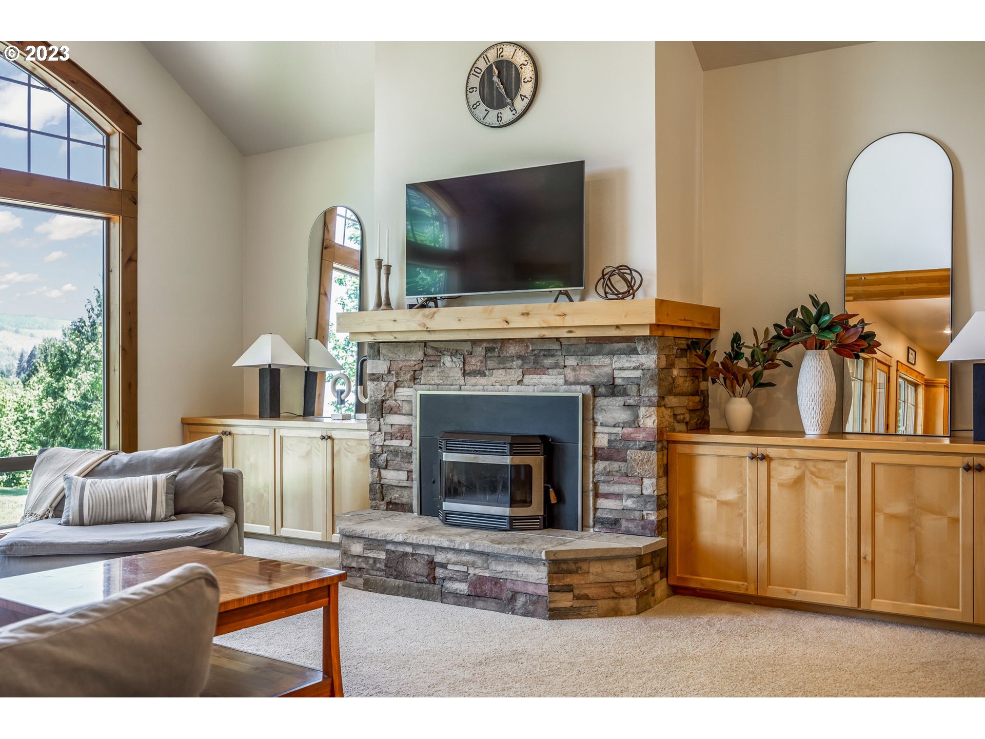 40091 Deerhorn Road Springfield, OR 97478 - Photo 12 of 46 a living room with furniture a flat screen tv and a fireplace