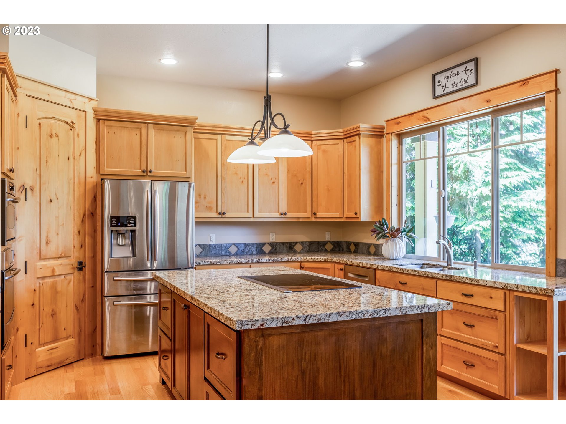 40091 Deerhorn Road Springfield, OR 97478 - Photo 17 of 46 a kitchen with stainless steel appliances granite countertop a sink a stove and a refrigerator