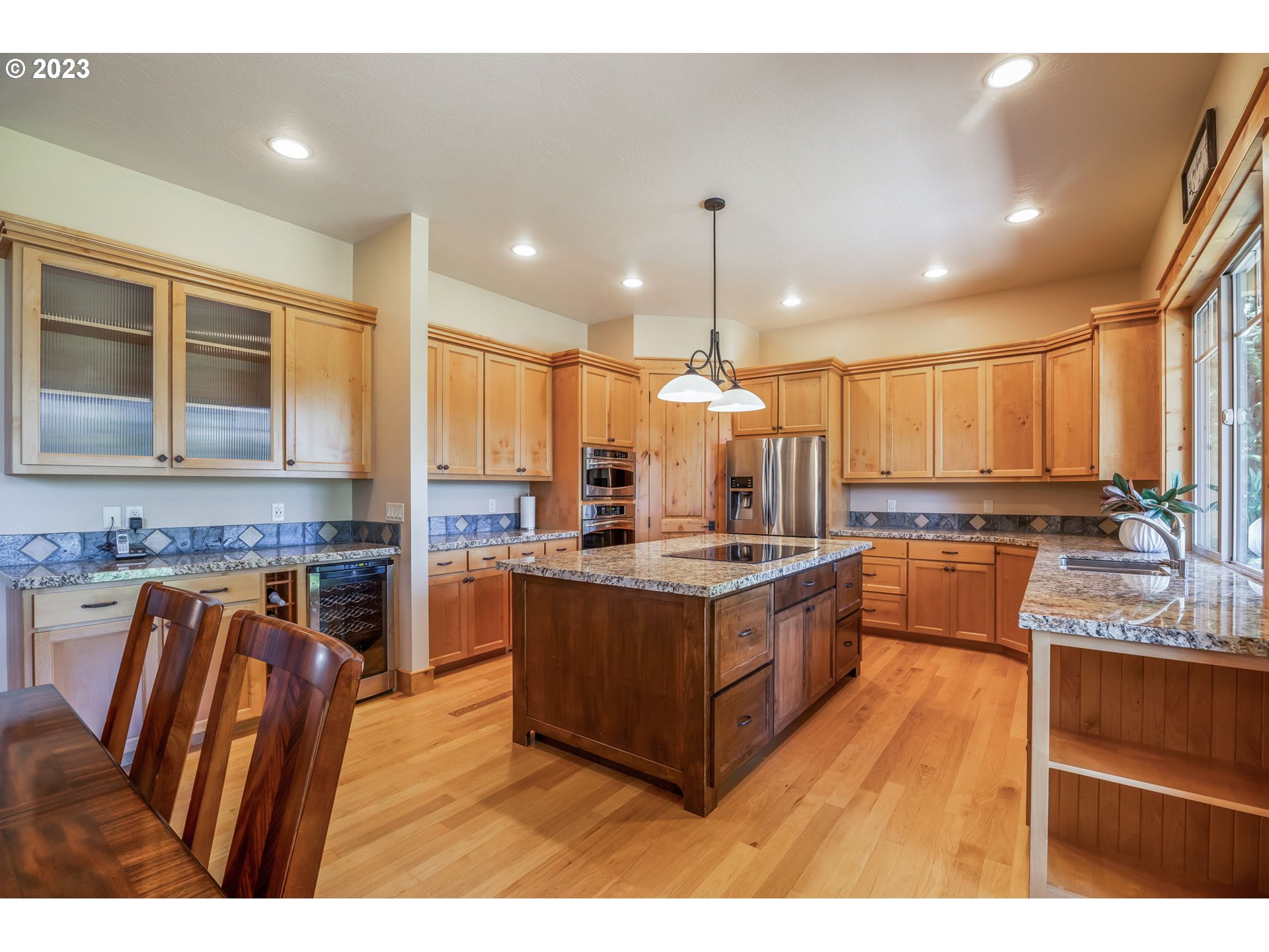 40091 Deerhorn Road Springfield, OR 97478 - Photo 18 of 46 a kitchen with stainless steel appliances kitchen island granite countertop a stove and a sink