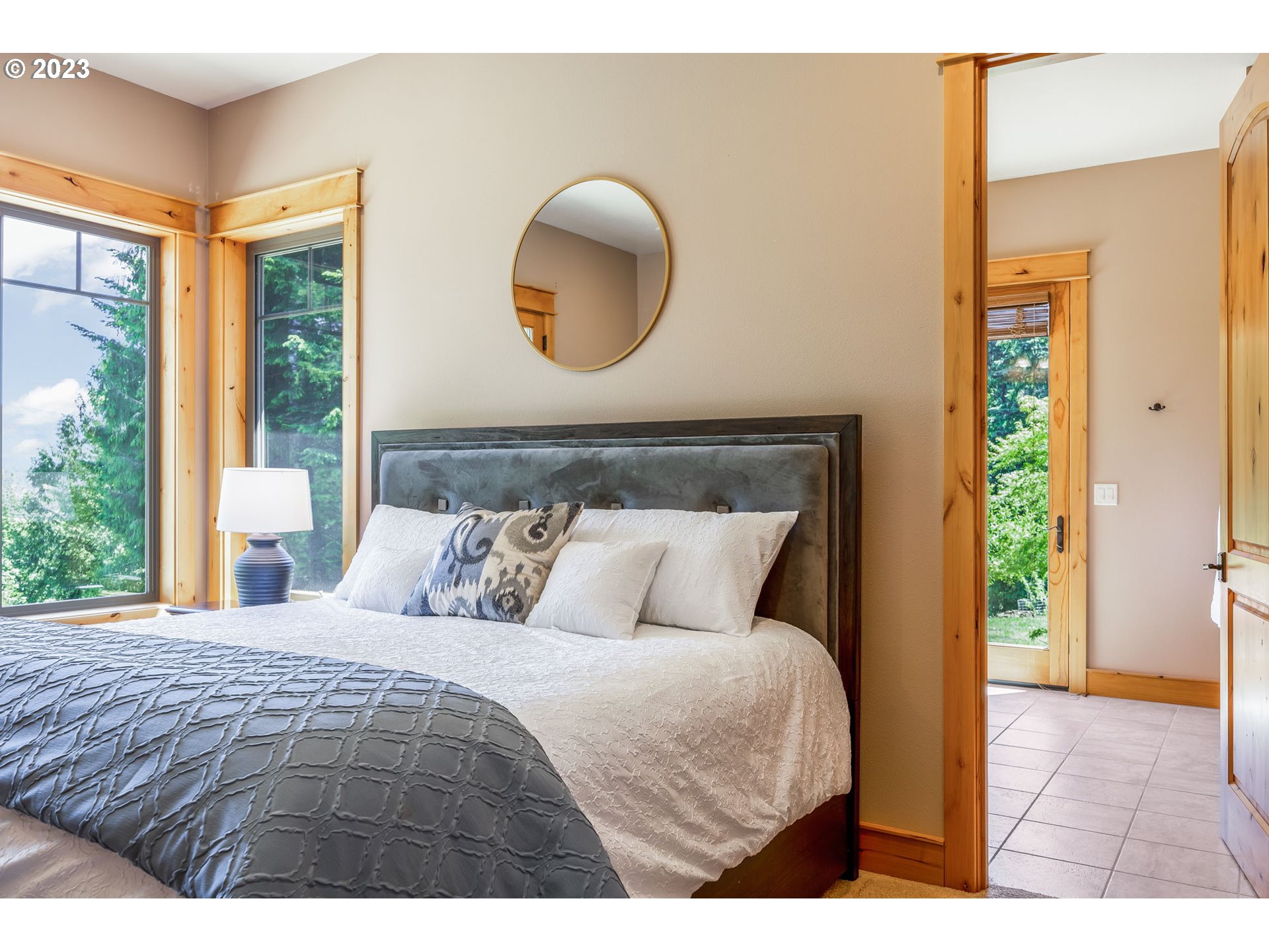 40091 Deerhorn Road Springfield, OR 97478 - Photo 25 of 46 a bedroom with a large bed and a large window