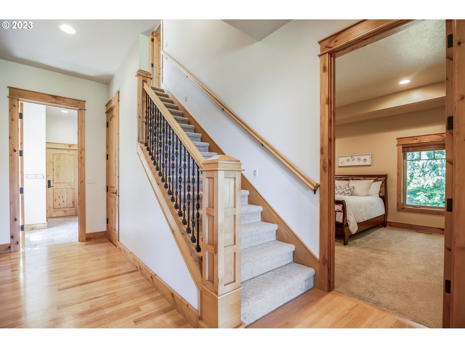 40091 Deerhorn Road Springfield, OR 97478 - Photo 32 of 46 a view of an entryway with wooden floor leading to a furnished livingroom and windows