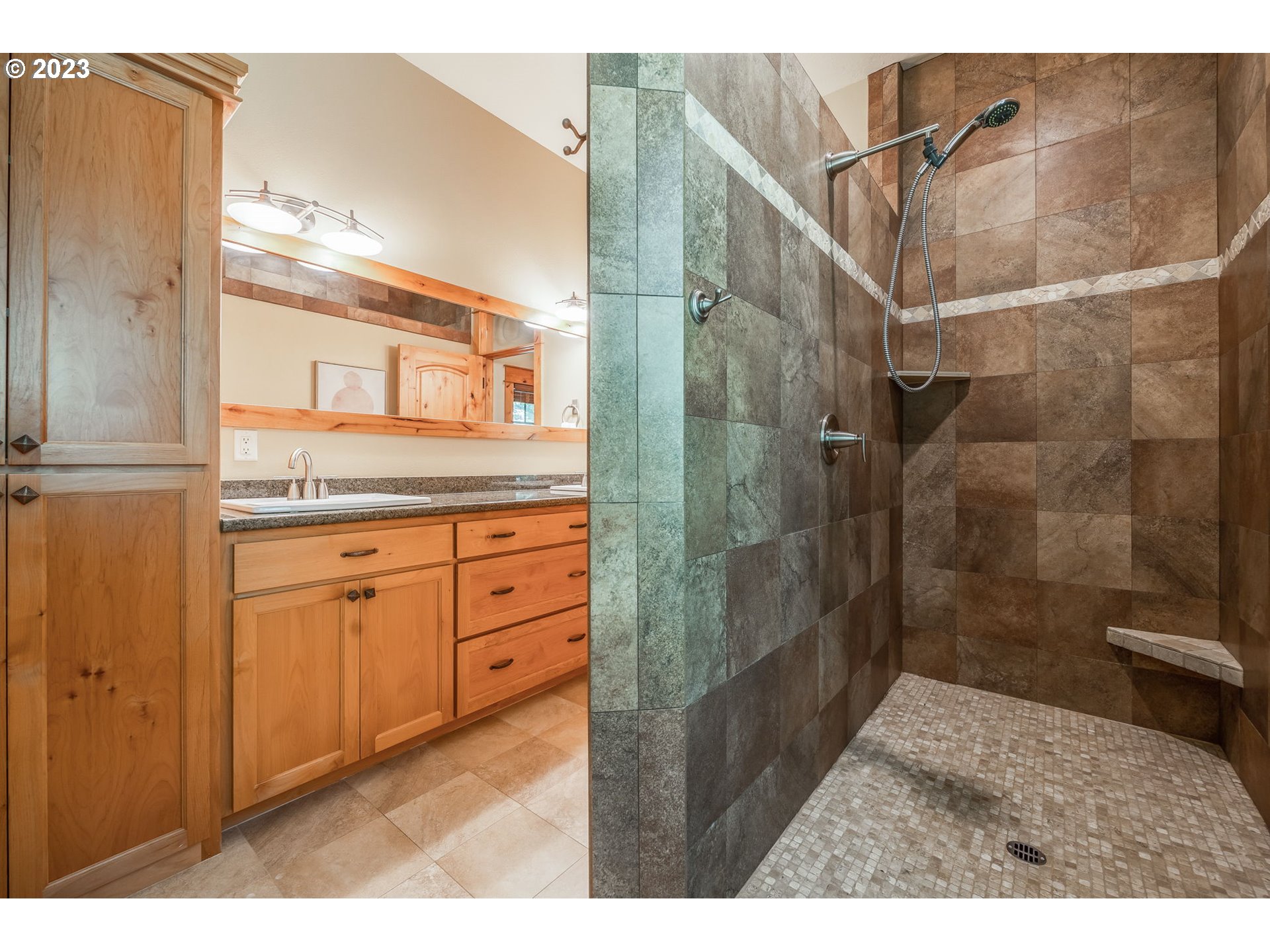 40091 Deerhorn Road Springfield, OR 97478 - Photo 35 of 46 a bathroom with a granite countertop sink a mirror and a shower