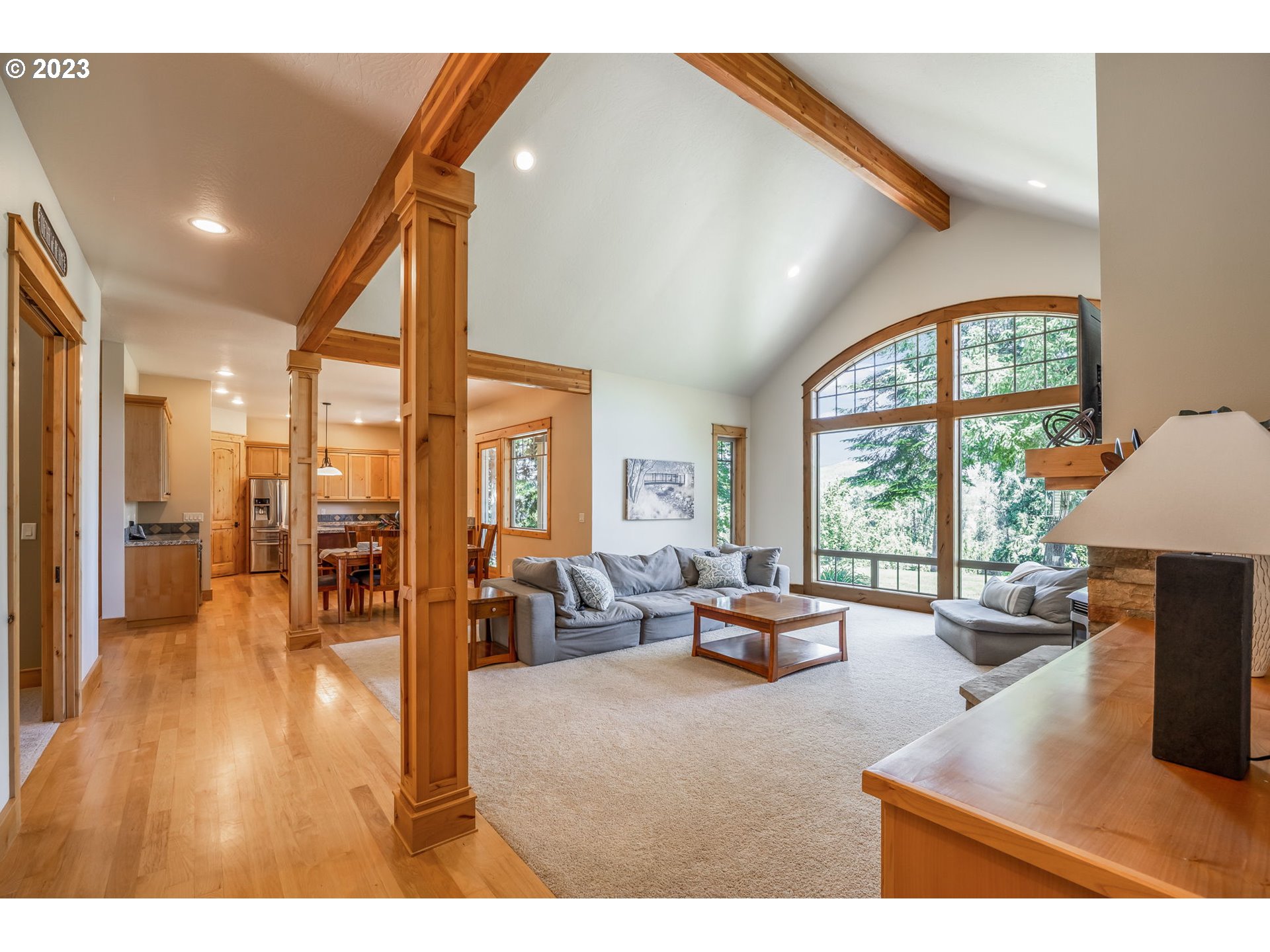 40091 Deerhorn Road Springfield, OR 97478 - Photo 10 of 46 a living room with furniture a large window with wooden floor