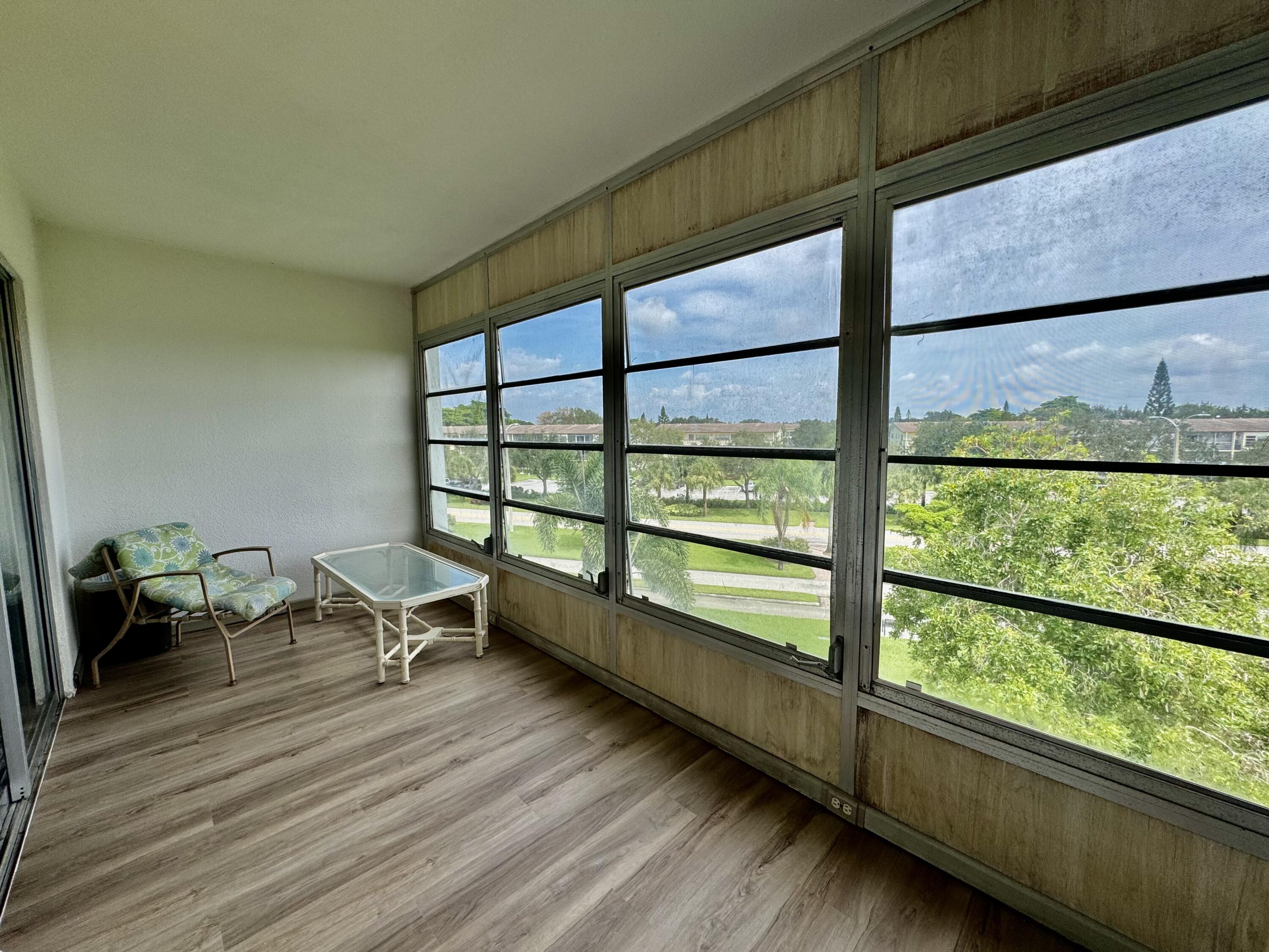 4019 Lincoln A Boca Raton, FL 33434 - Photo 25 of 36 a view of a room with wooden floor and furniture