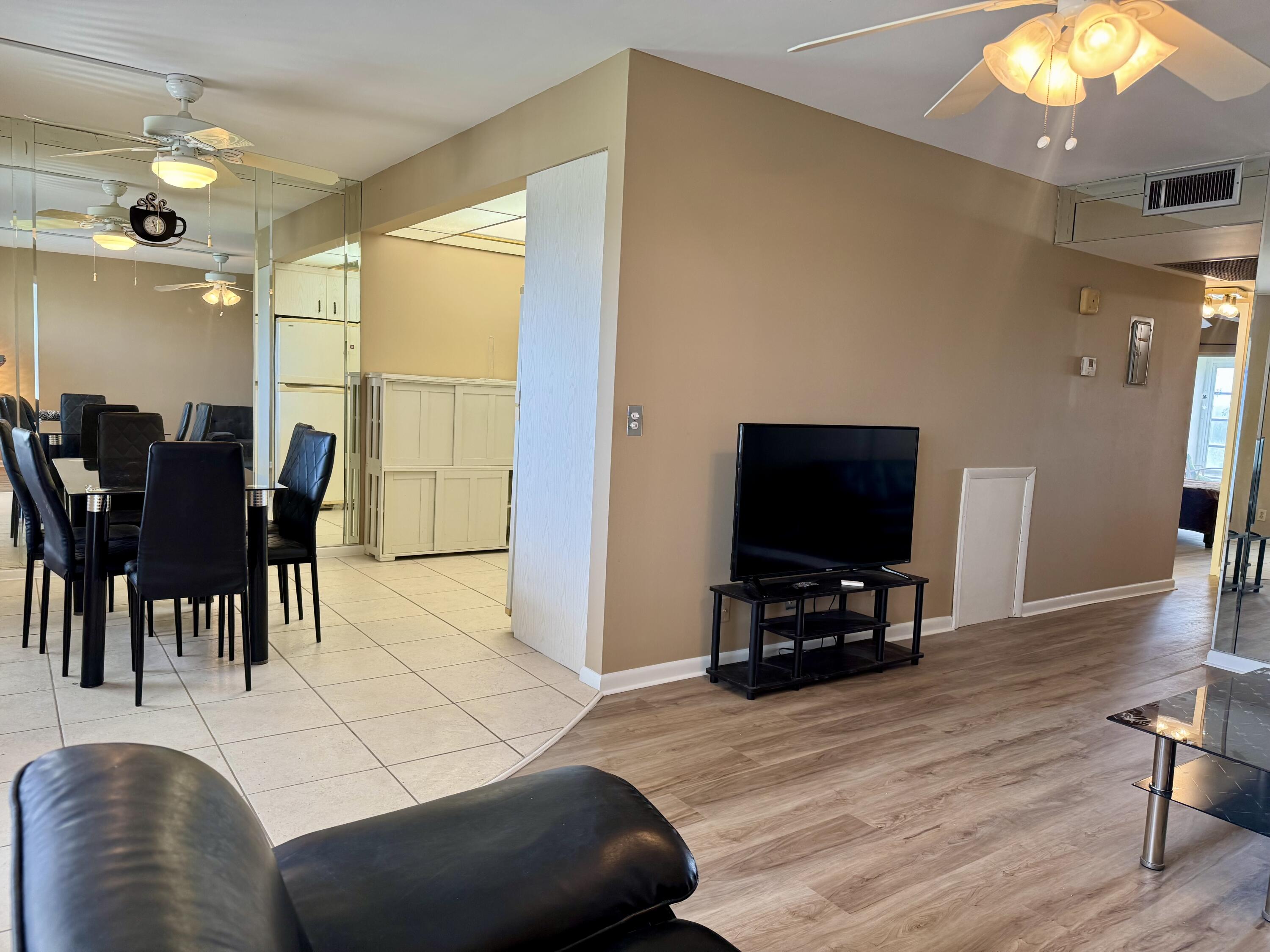 4019 Lincoln A Boca Raton, FL 33434 - Photo 6 of 36 a living room with furniture and a flat screen tv