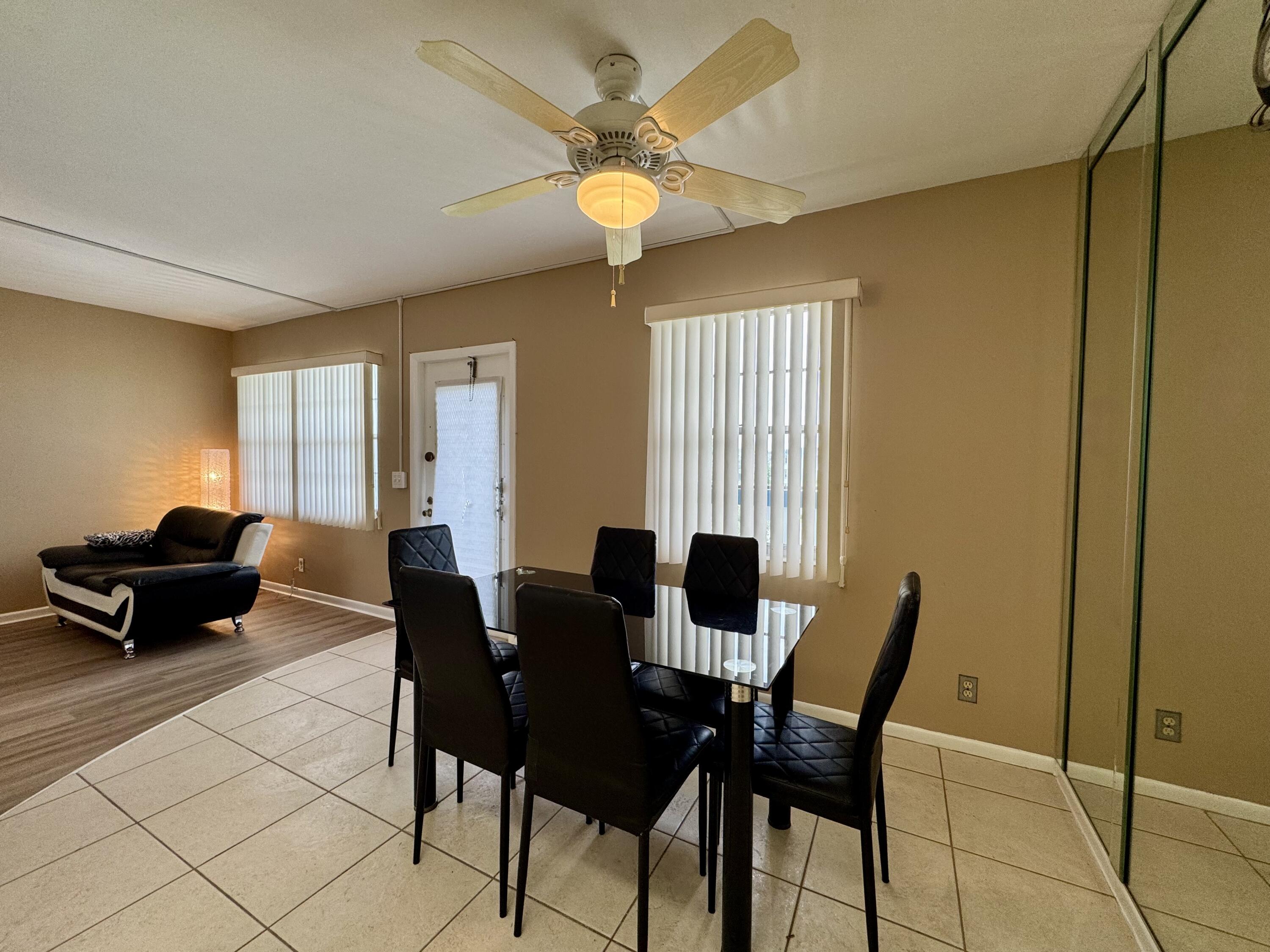 4019 Lincoln A Boca Raton, FL 33434 - Photo 10 of 36 a living room with furniture and a window